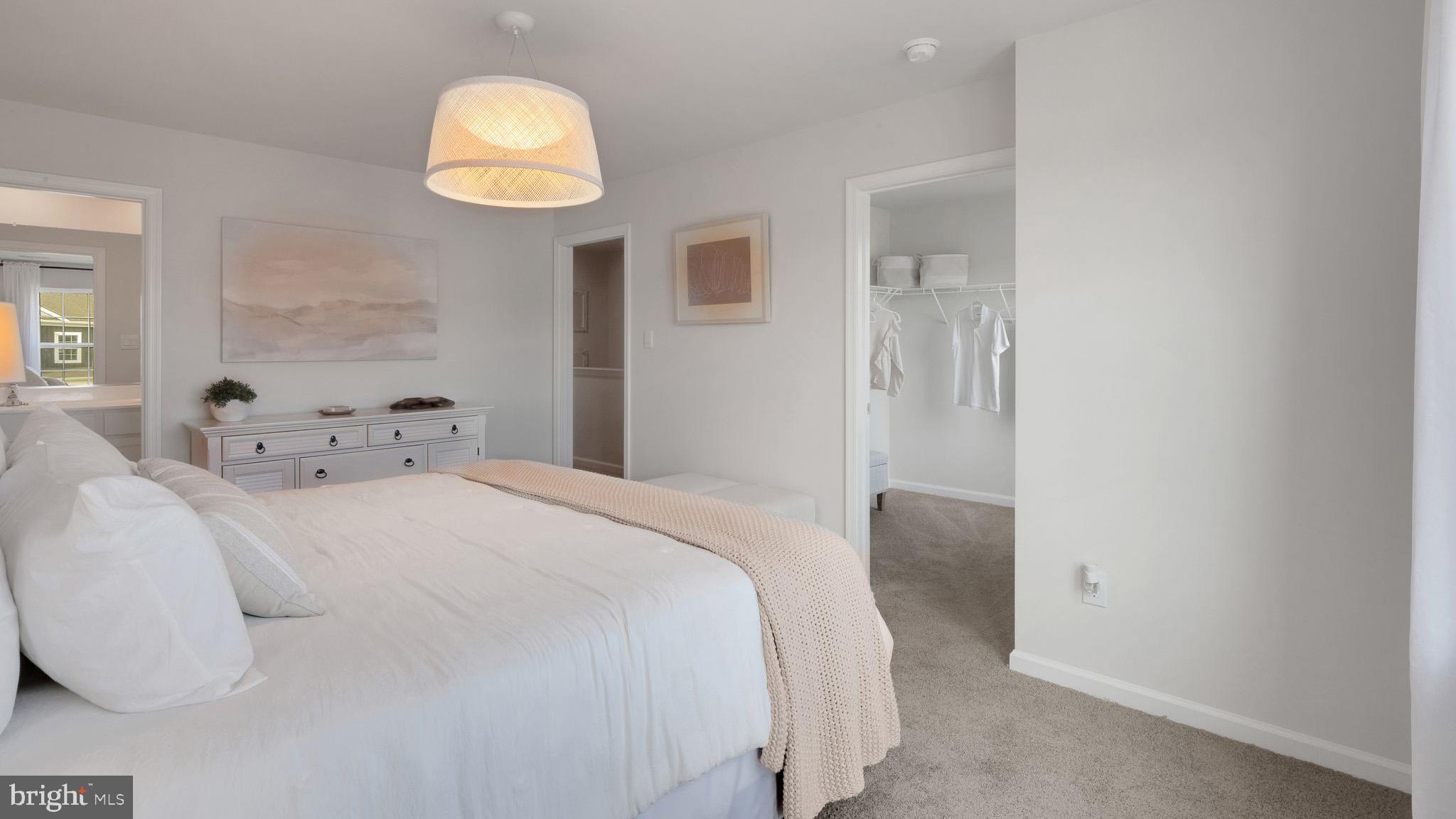 4 Whaler Drive Runnemede, NJ 08078 - Photo 19 of 24 a bedroom with a bed and a chandelier