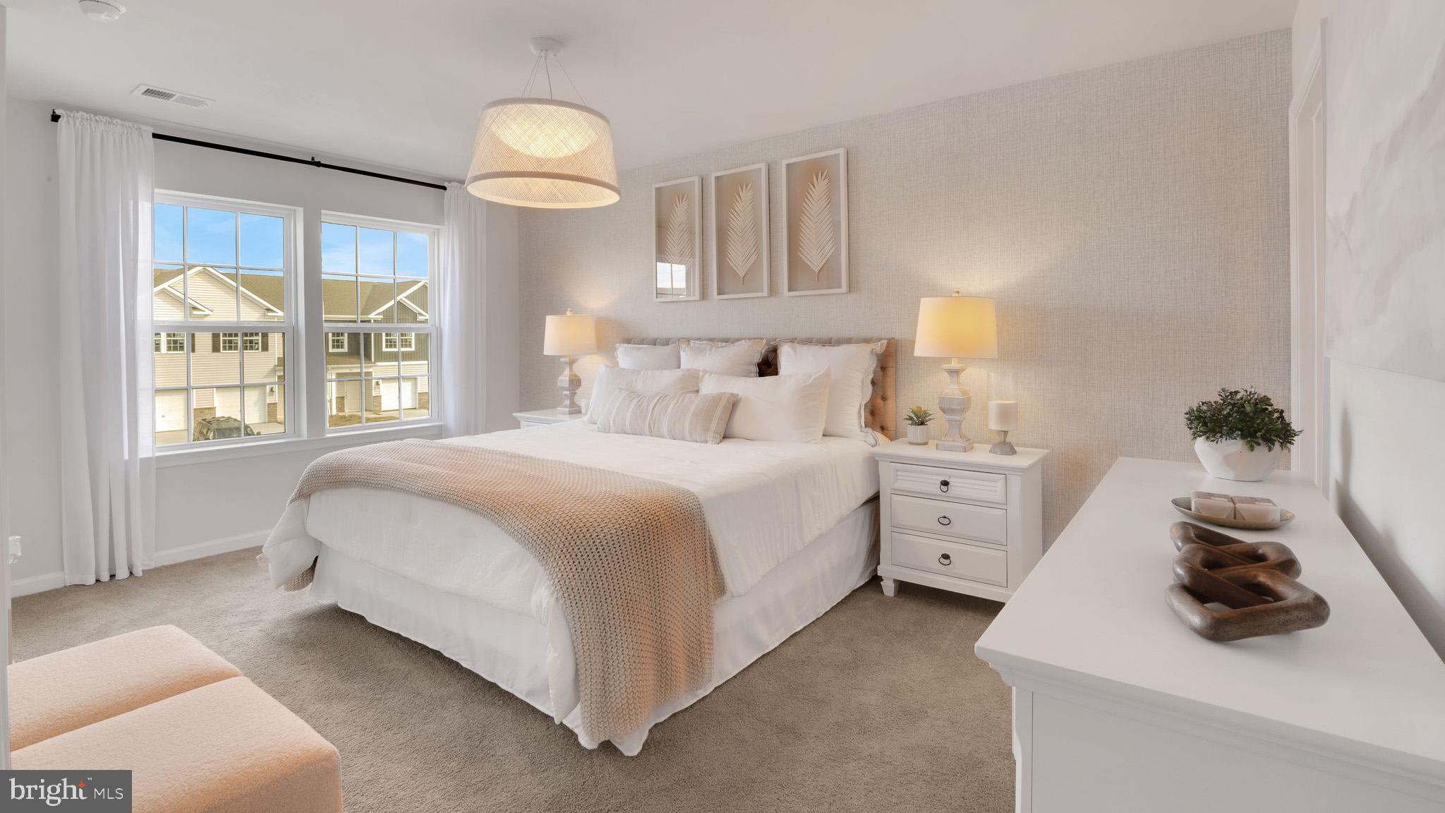 4 Whaler Drive Runnemede, NJ 08078 - Photo 4 of 24 a bedroom with a bed and a chandelier