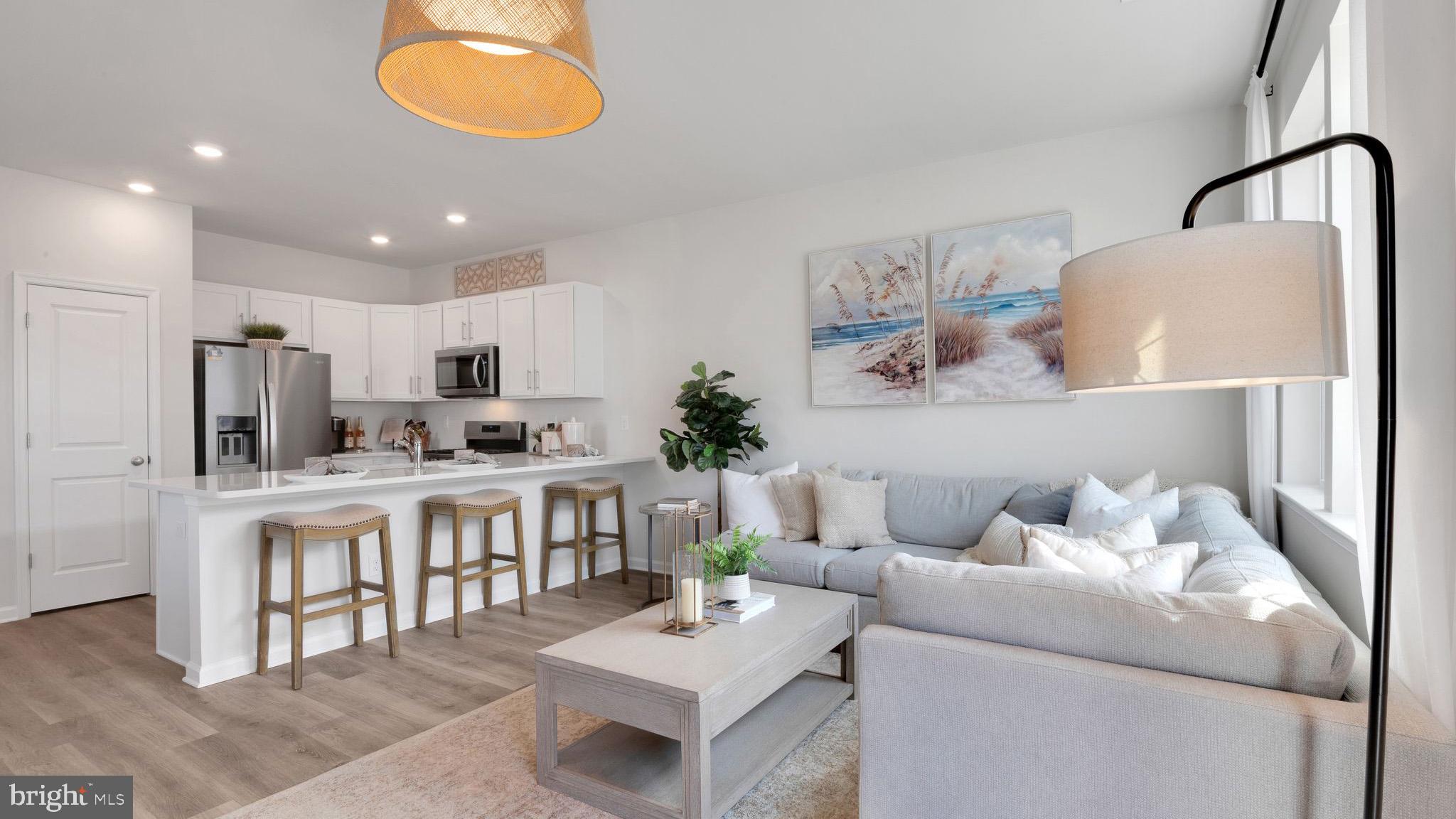 4 Whaler Drive Runnemede, NJ 08078 - Photo 9 of 24 a living room with stainless steel appliances furniture and a kitchen view