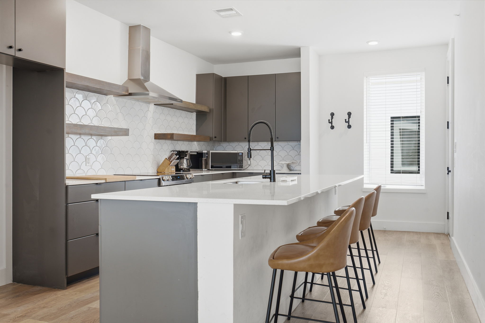 2709 East 5th Street, Unit 1306 Austin, TX 78702 - Photo 8 of 28 A well-appointed kitchen features a large island and ample cabinet space.