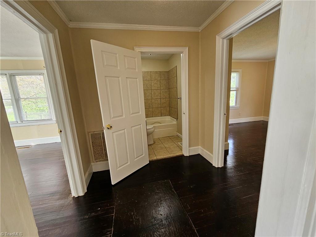 607 Arch Street High Point, NC 27260 - Photo 17 of 23 Hallway leads to two bedrooms and full bath