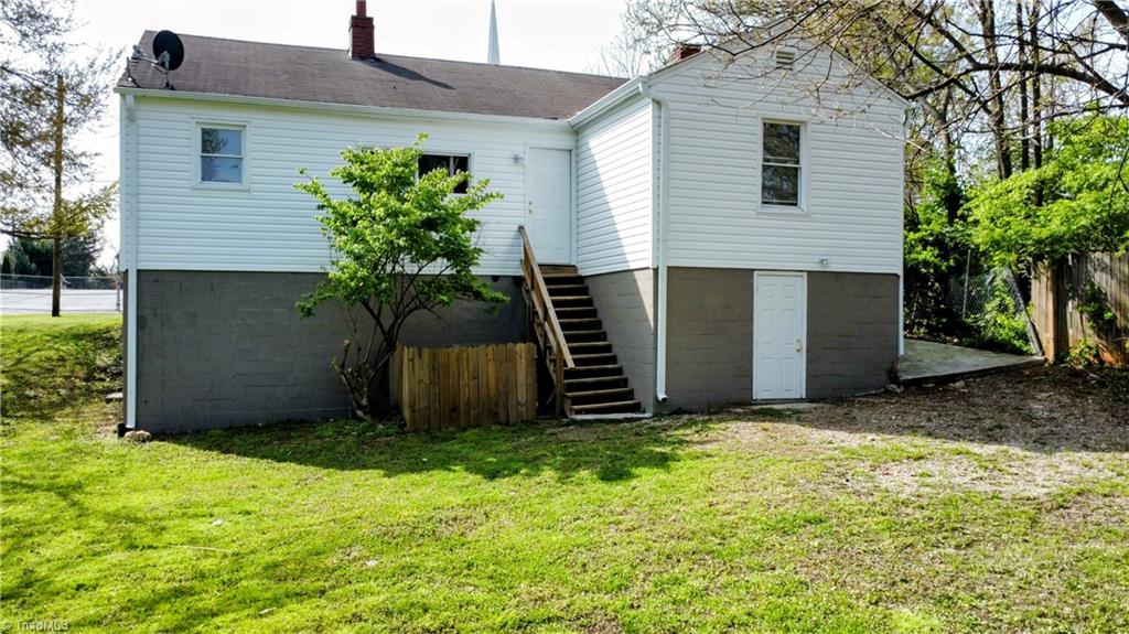 607 Arch Street High Point, NC 27260 - Photo 18 of 23 Rear view of this charming bungalow with utility basement