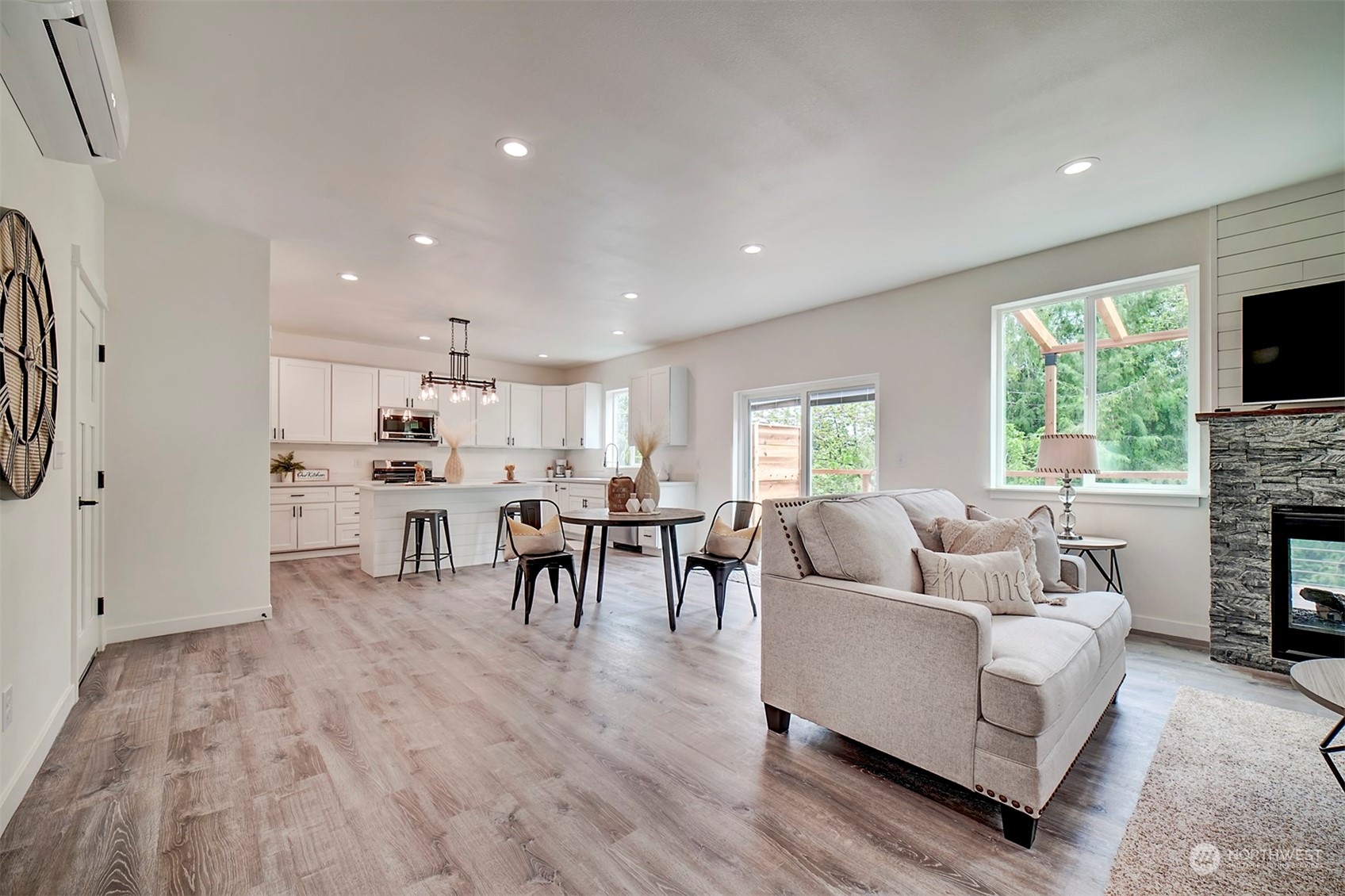 835 Northwest Finn Hill Road Poulsbo, WA 98370 - Photo 11 of 40 a living room with furniture and a fireplace