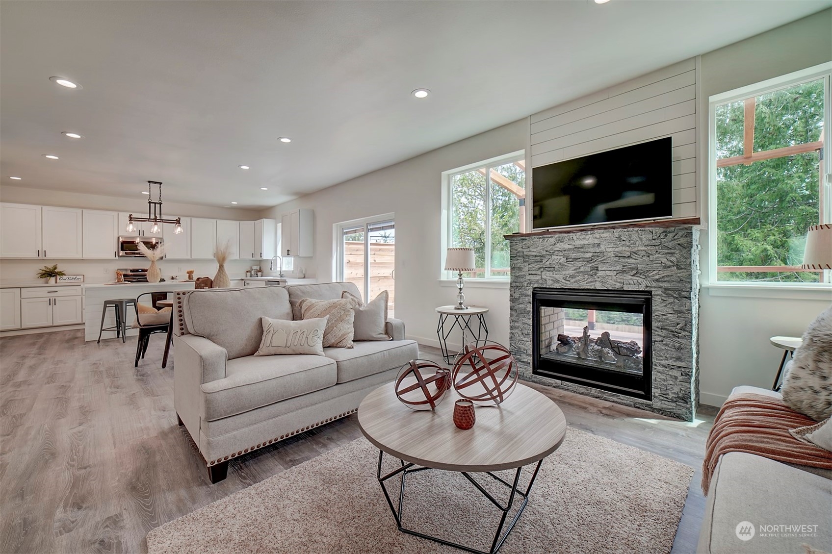 835 Northwest Finn Hill Road Poulsbo, WA 98370 - Photo 14 of 40 a living room with furniture and a fireplace