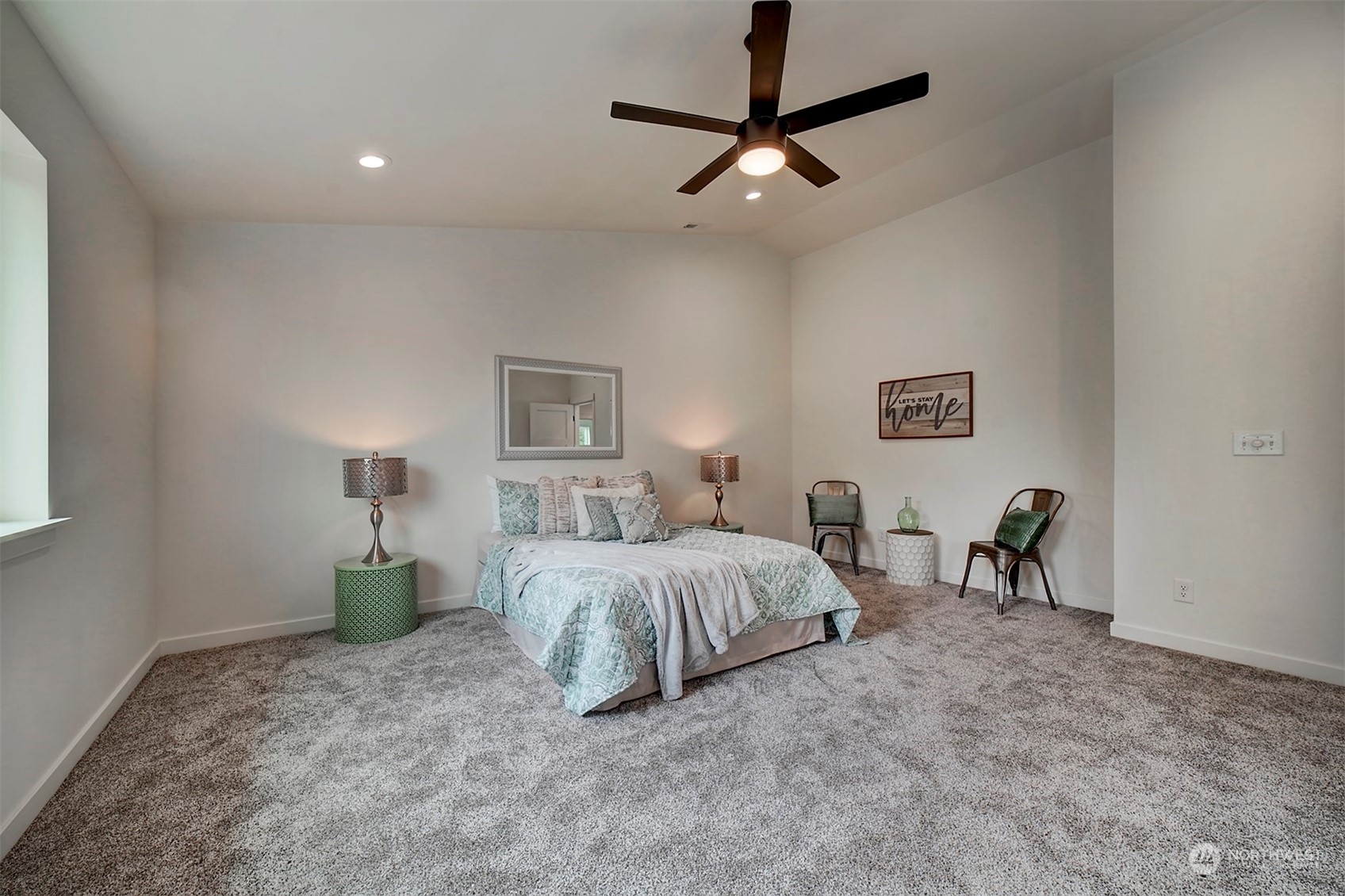 835 Northwest Finn Hill Road Poulsbo, WA 98370 - Photo 23 of 40 a spacious bedroom with two beds and painting on the wall