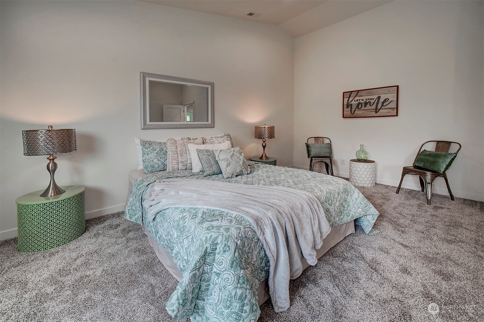 835 Northwest Finn Hill Road Poulsbo, WA 98370 - Photo 24 of 40 a bedroom with a bed and chair