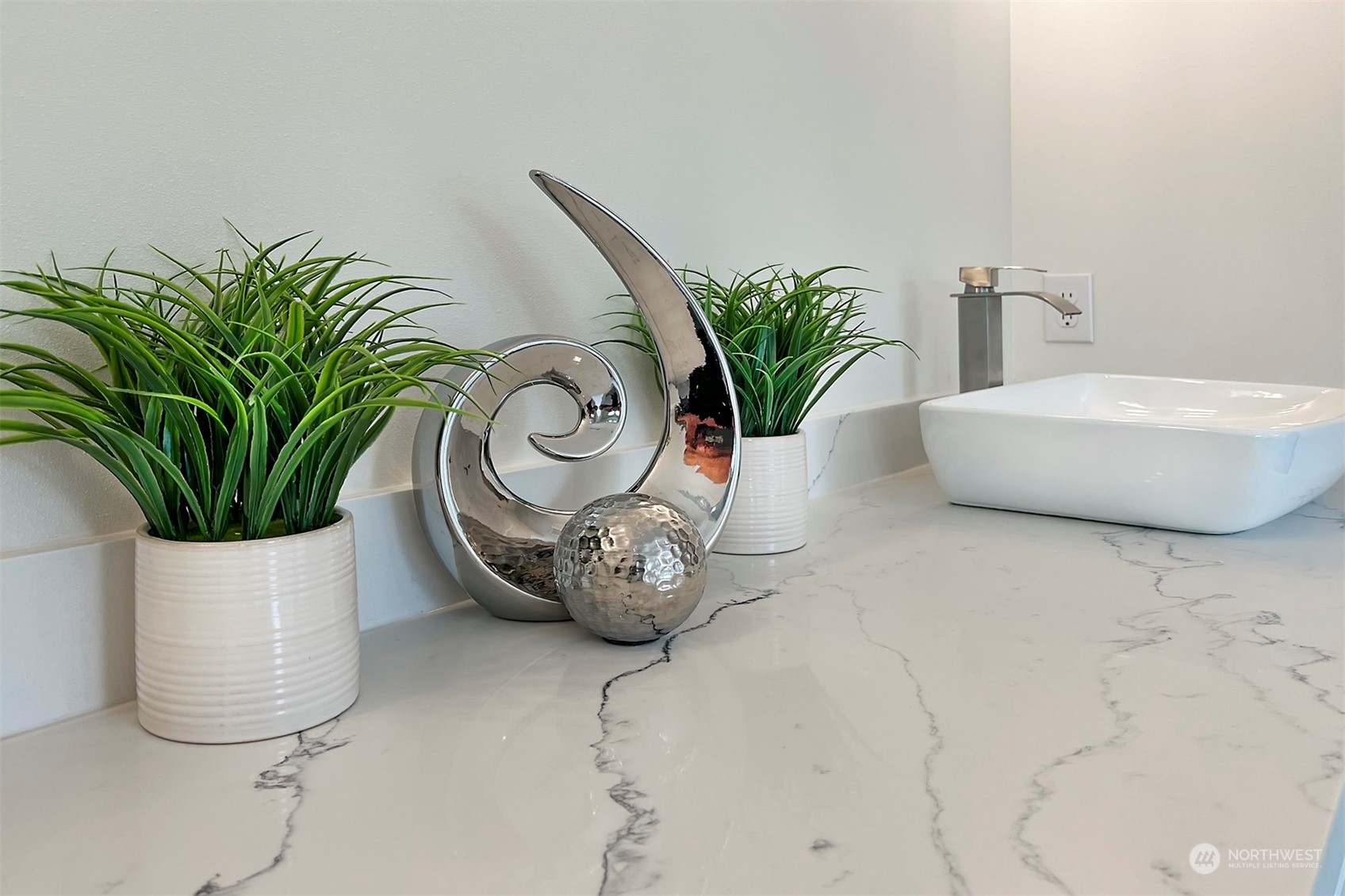 835 Northwest Finn Hill Road Poulsbo, WA 98370 - Photo 28 of 40 a white vase with flowers and white wooden cabinets