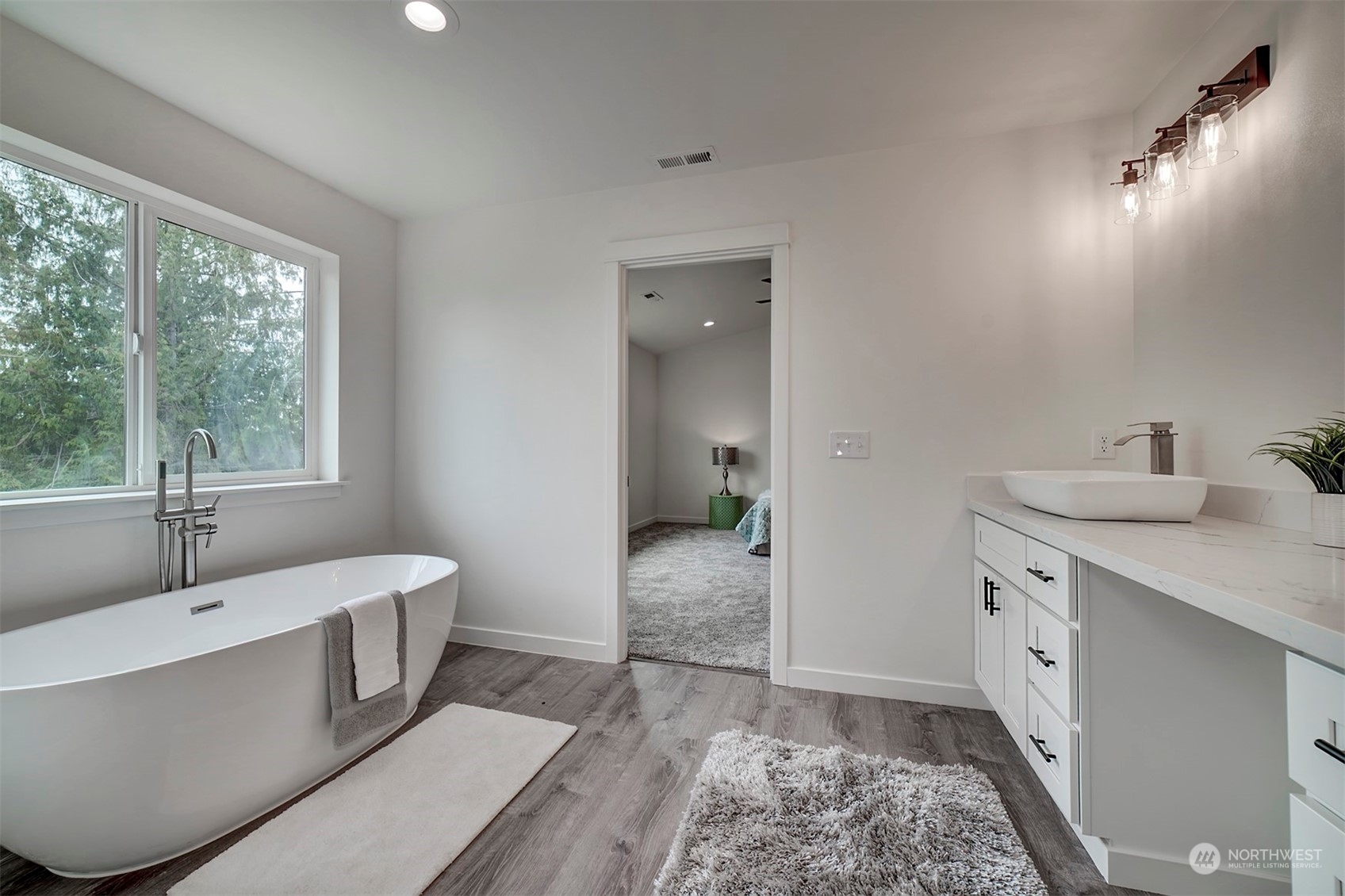 835 Northwest Finn Hill Road Poulsbo, WA 98370 - Photo 30 of 40 a spacious bathroom with a tub sink and mirror
