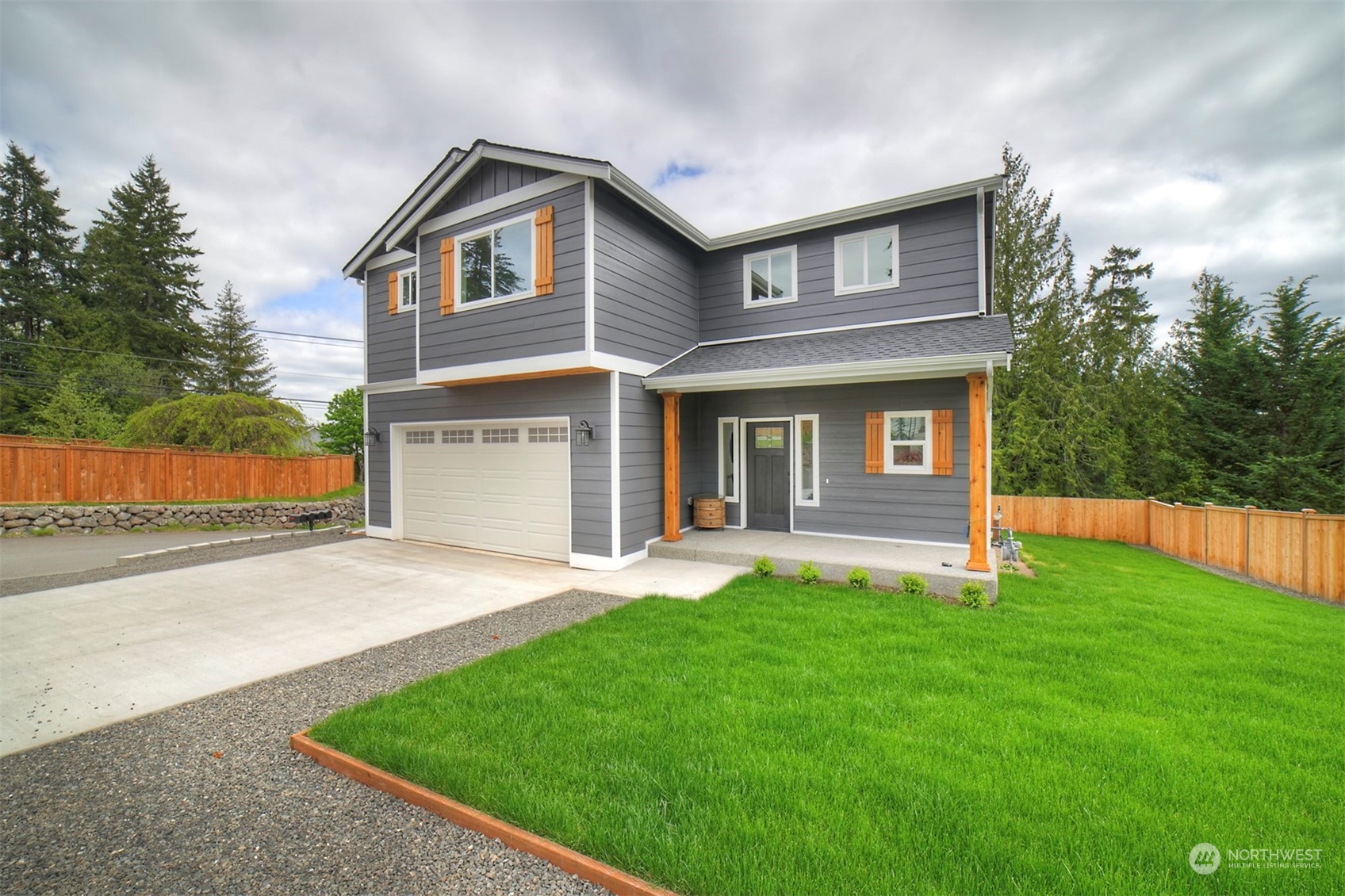 835 Northwest Finn Hill Road Poulsbo, WA 98370 - Photo 3 of 40 front view of a house with a yard