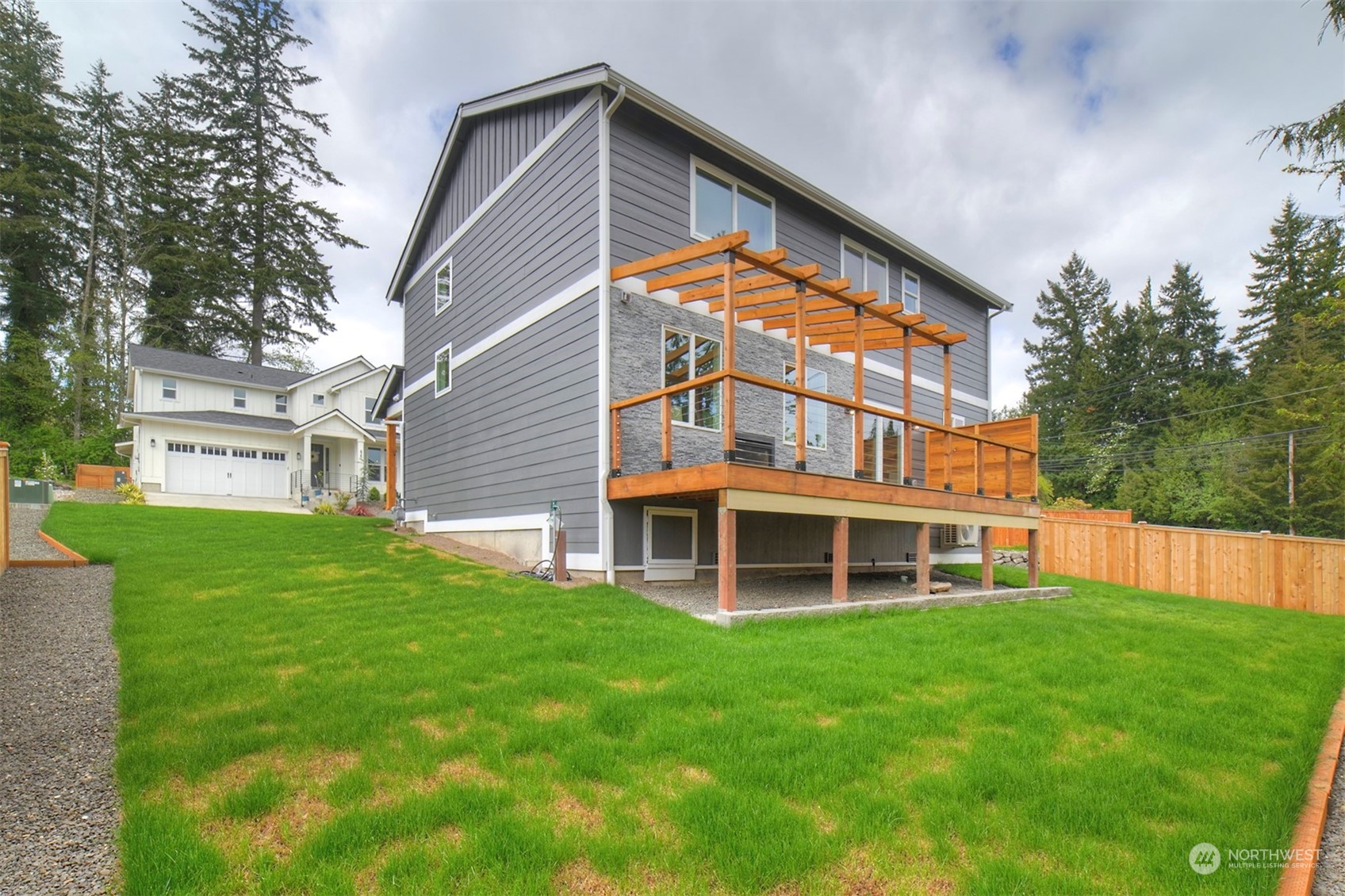 835 Northwest Finn Hill Road Poulsbo, WA 98370 - Photo 38 of 40 a front view of a house with a yard