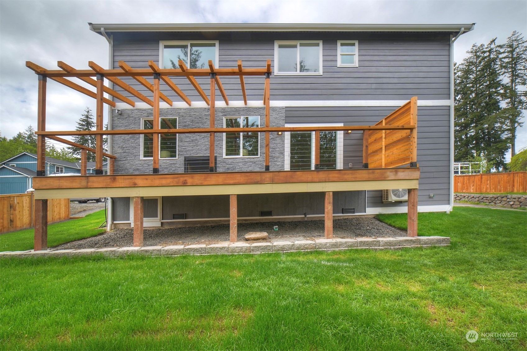 835 Northwest Finn Hill Road Poulsbo, WA 98370 - Photo 39 of 40 a front view of a house with a yard and staircase