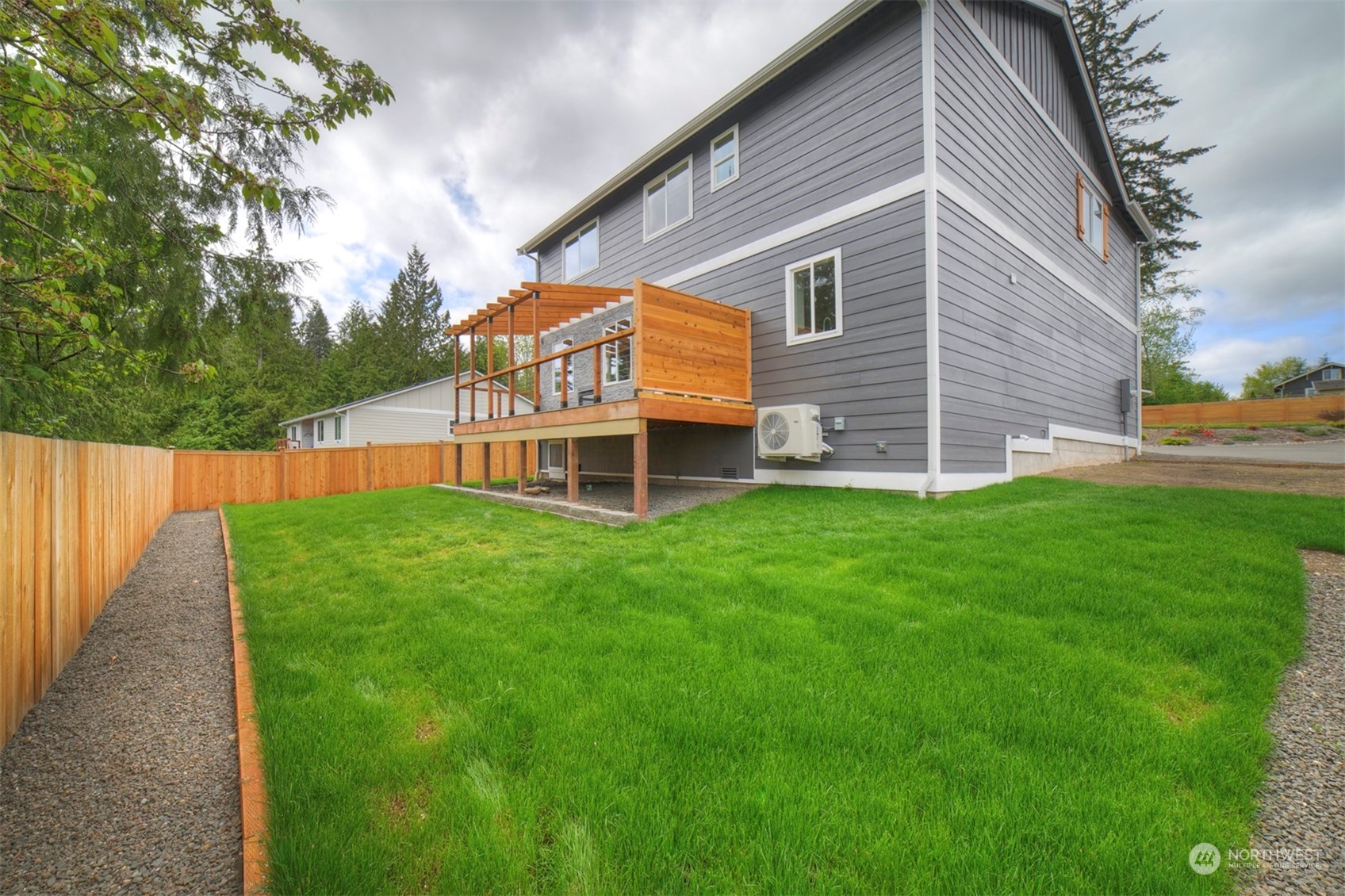 835 Northwest Finn Hill Road Poulsbo, WA 98370 - Photo 40 of 40 a front view of a house with a yard and trees
