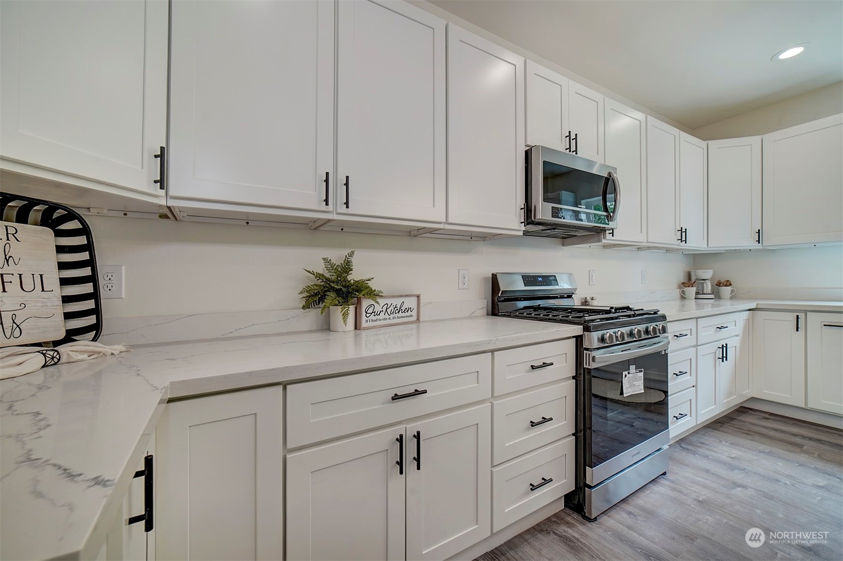 835 Northwest Finn Hill Road Poulsbo, WA 98370 - Photo 9 of 40 a kitchen with white cabinets and white appliances