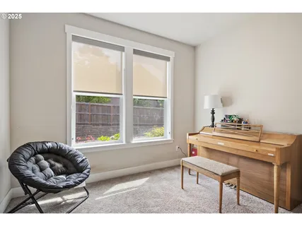 a living room with a couch and a window