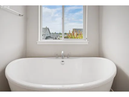 a white bath tub sitting in a bathroom