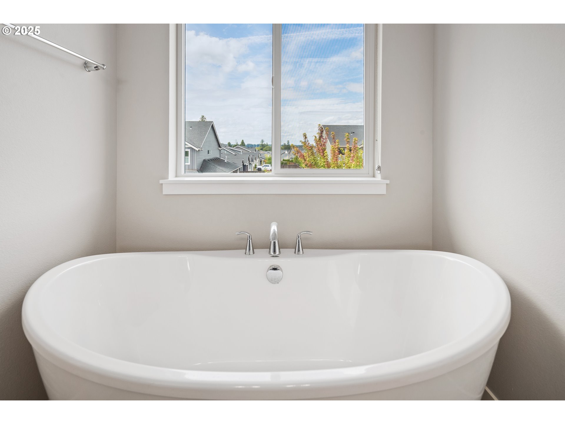 5770 North 86th Circle Camas, WA 98607 - Photo 16 of 27 a white bath tub sitting in a bathroom