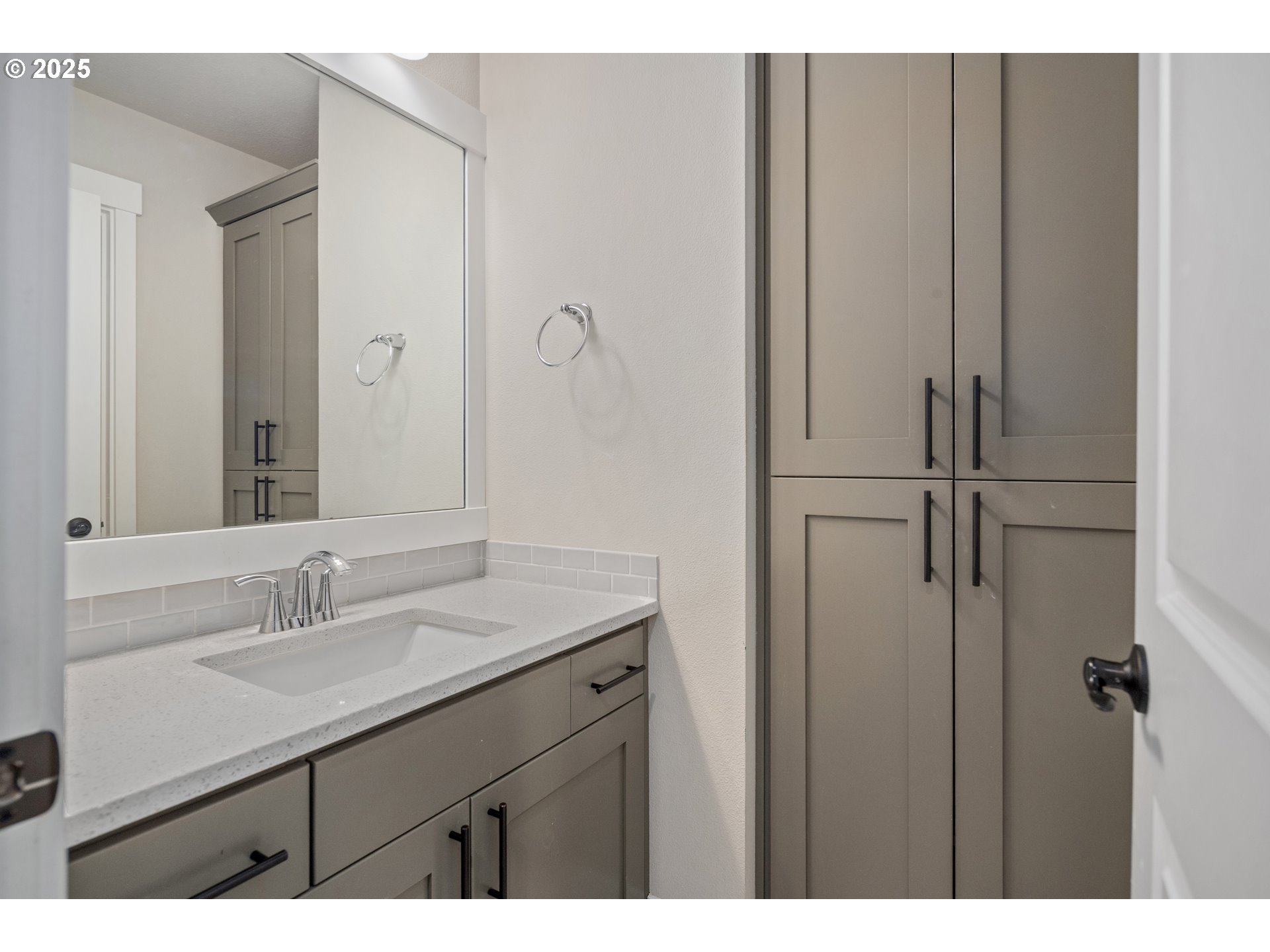 5770 North 86th Circle Camas, WA 98607 - Photo 19 of 27 a bathroom with a sink and mirror