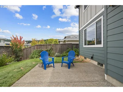 a backyard of a house with outdoor seating