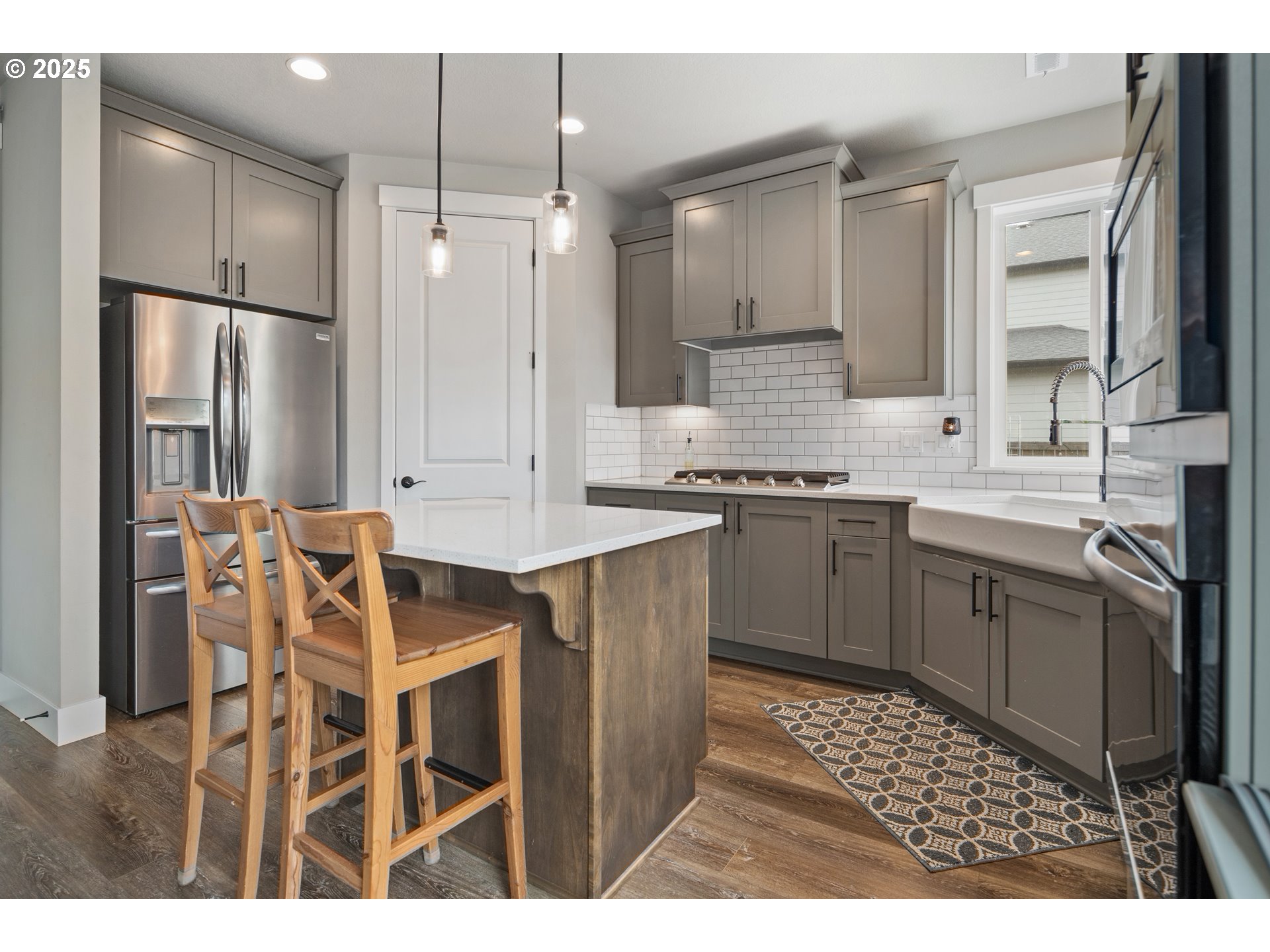 5770 North 86th Circle Camas, WA 98607 - Photo 8 of 27 a kitchen with a sink stove and refrigerator