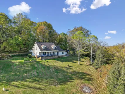 a view of a house with a big yard