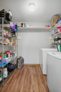a kitchen with cabinets appliances a sink and a counter top space