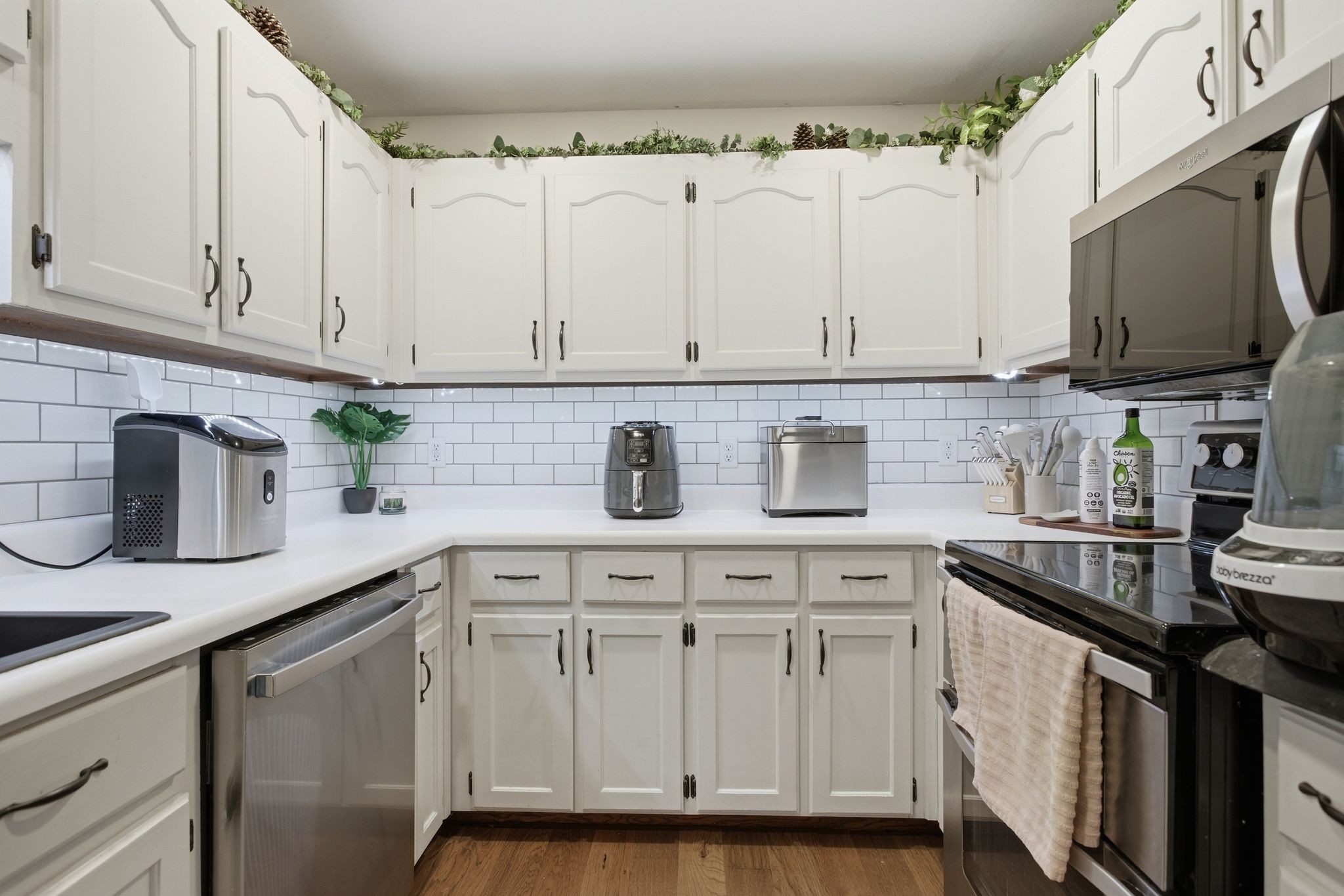 1469 Roy Sellers Road Columbia, TN 38401 - Photo 33 of 55 a kitchen with white cabinets and a sink