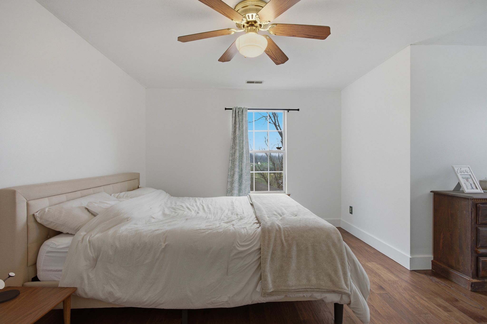 1469 Roy Sellers Road Columbia, TN 38401 - Photo 36 of 55 a bedroom with a bed and a flat screen tv