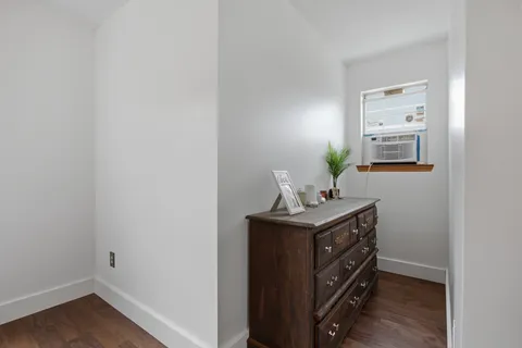 a bathroom with a double vanity sink and a toilet