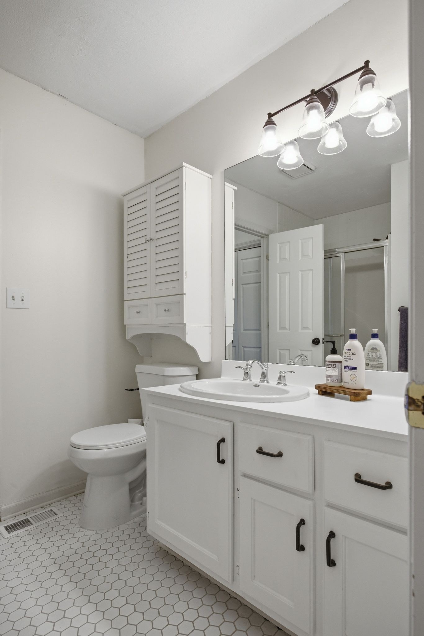 1469 Roy Sellers Road Columbia, TN 38401 - Photo 40 of 55 a bathroom with a double vanity sink and a toilet