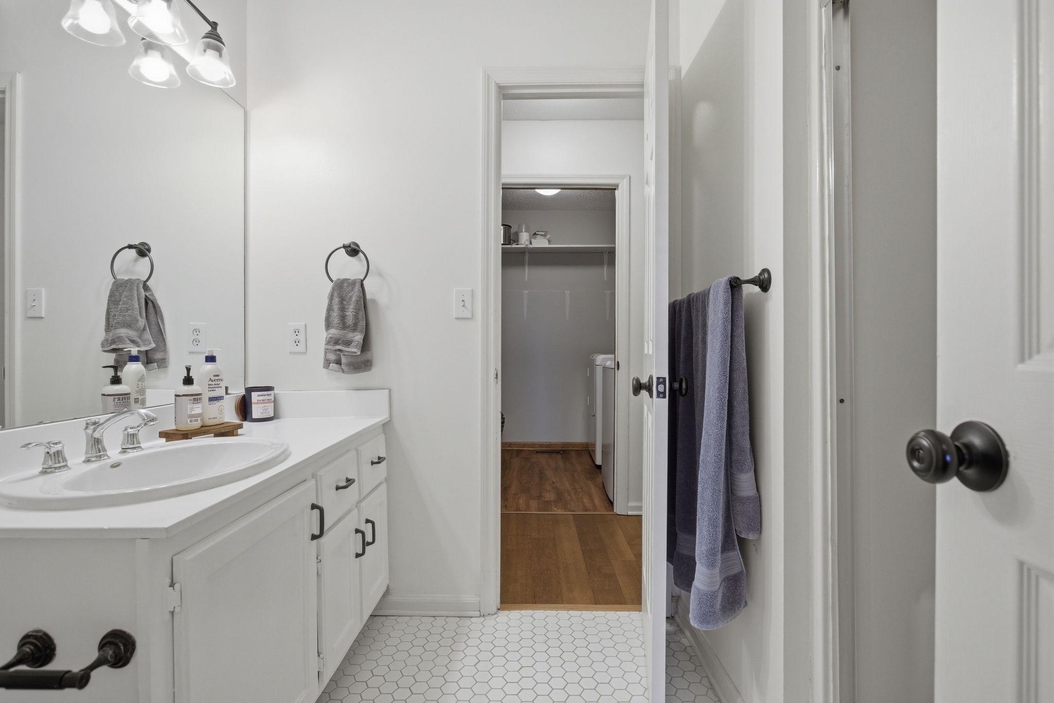 1469 Roy Sellers Road Columbia, TN 38401 - Photo 41 of 55 a bathroom with a double vanity sink a mirror and shower
