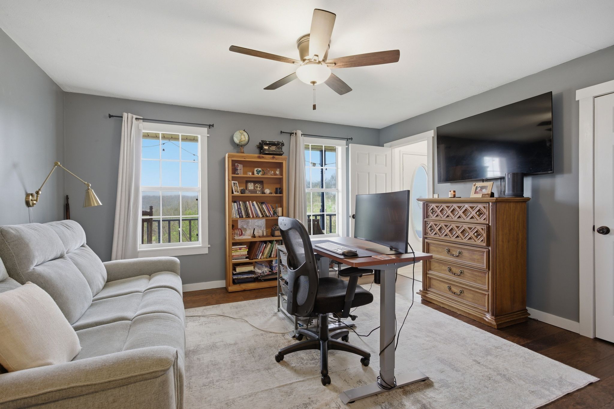 1469 Roy Sellers Road Columbia, TN 38401 - Photo 49 of 55 a living room with furniture a flat screen tv and a window