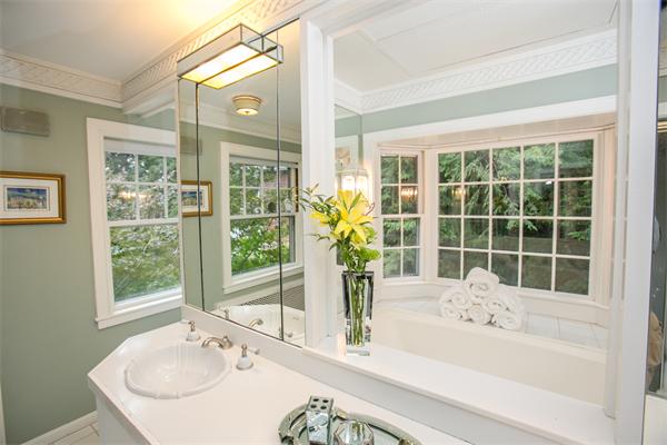 455 Glen Road Weston, MA 02493 - Photo 10 of 18 a bathroom with a granite countertop tub and a sink