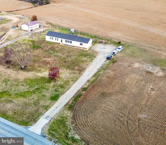 a view of a big yard with an ocean view