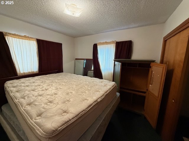 101 Brooks Road Carson, WA 98610 - Photo 15 of 16 a bed sitting in a bedroom next to a window