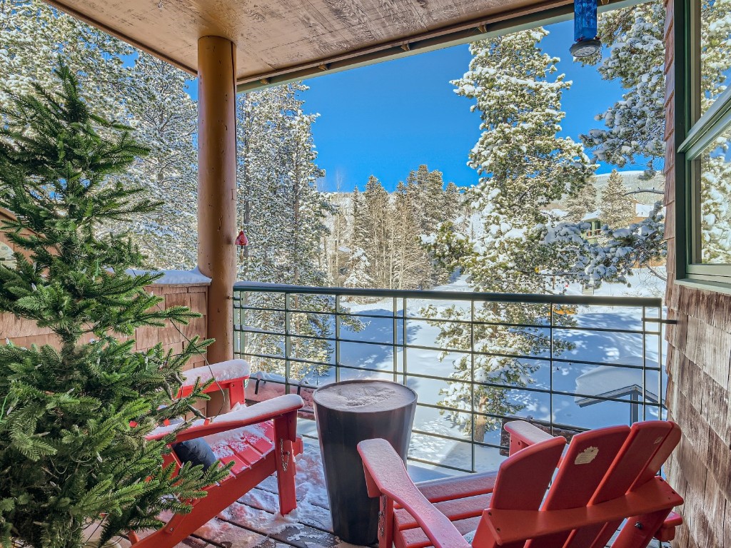 2017 Soda Ridge Road, Unit 1939 Keystone, CO 80435 - Photo 20 of 27 a view of a balcony with chairs and table