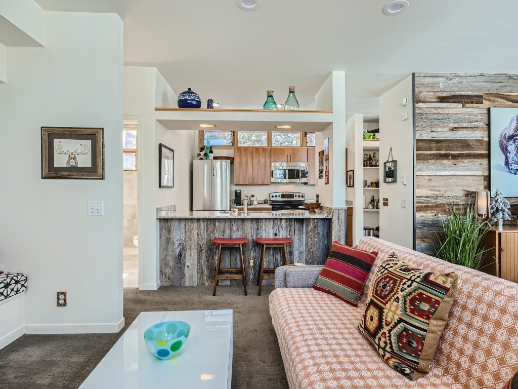 2017 Soda Ridge Road, Unit 1939 Keystone, CO 80435 - Photo 6 of 27 a living room with furniture and a floor to ceiling window