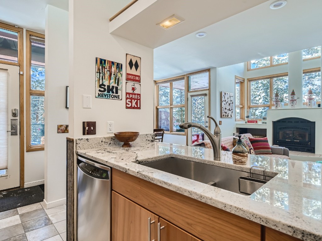 2017 Soda Ridge Road, Unit 1939 Keystone, CO 80435 - Photo 7 of 27 a kitchen with stainless steel appliances granite countertop a sink and a refrigerator
