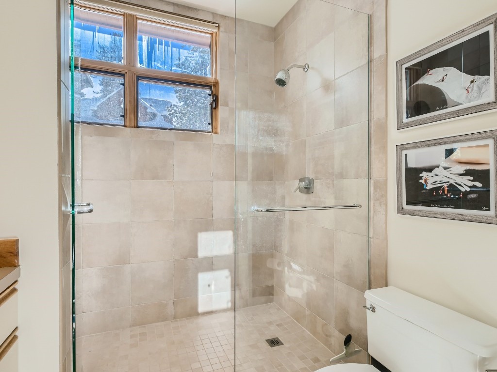 2017 Soda Ridge Road, Unit 1939 Keystone, CO 80435 - Photo 9 of 27 a bathroom with a toilet and shower
