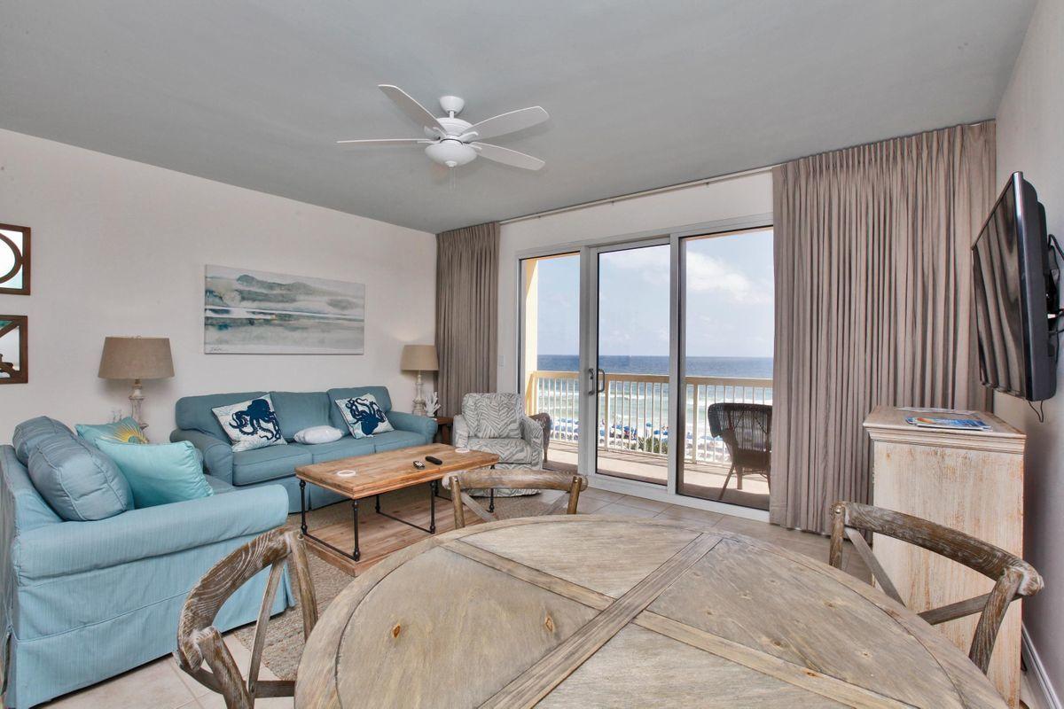 15817 Front Beach Road, Unit 407W Panama City Beach, FL 32413 - Photo 2 of 23 a living room with furniture and a large window