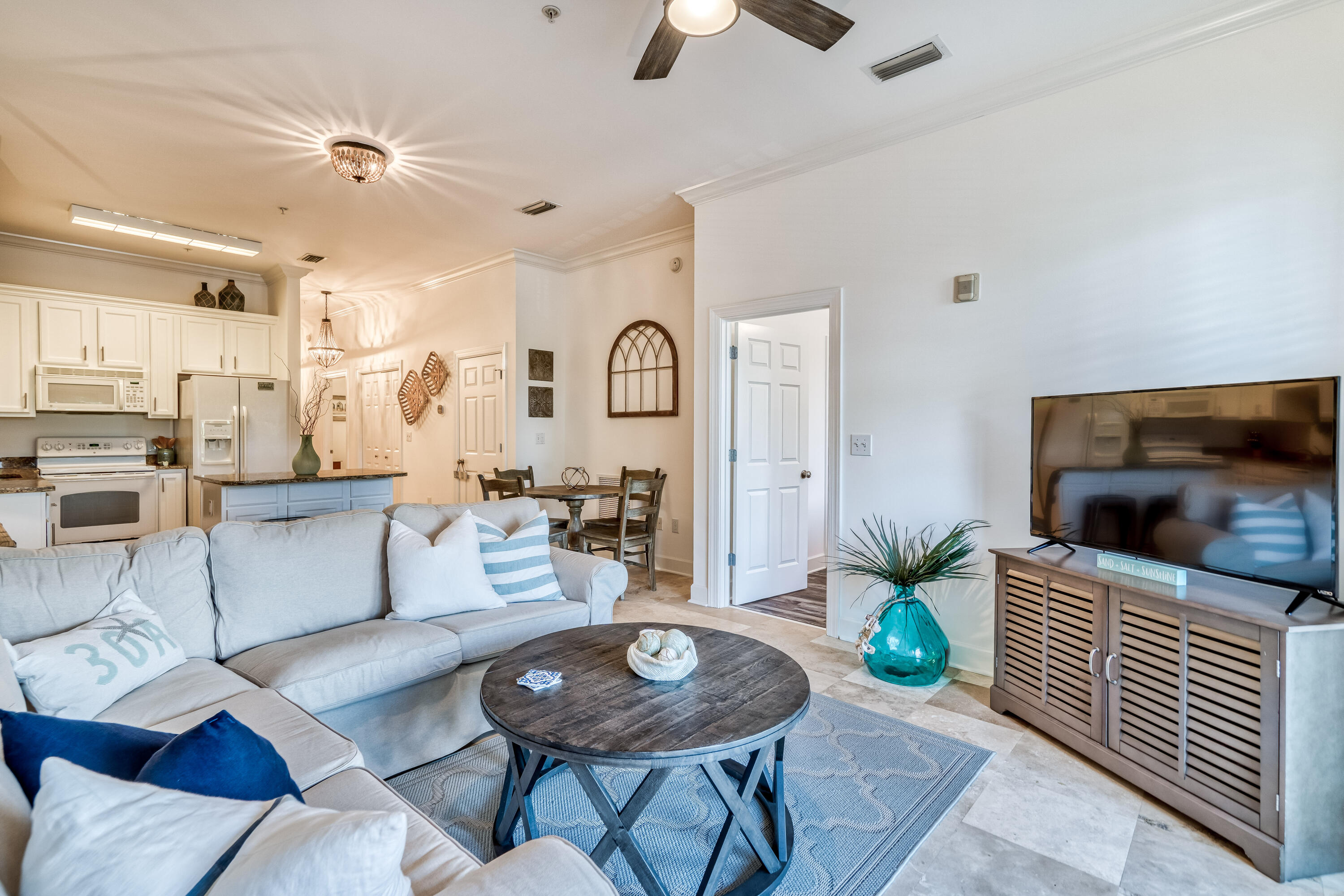231 Somerset Bridge Road, Unit 1207 Santa Rosa Beach, FL 32459 - Photo 13 of 48 a living room with furniture and a flat screen tv