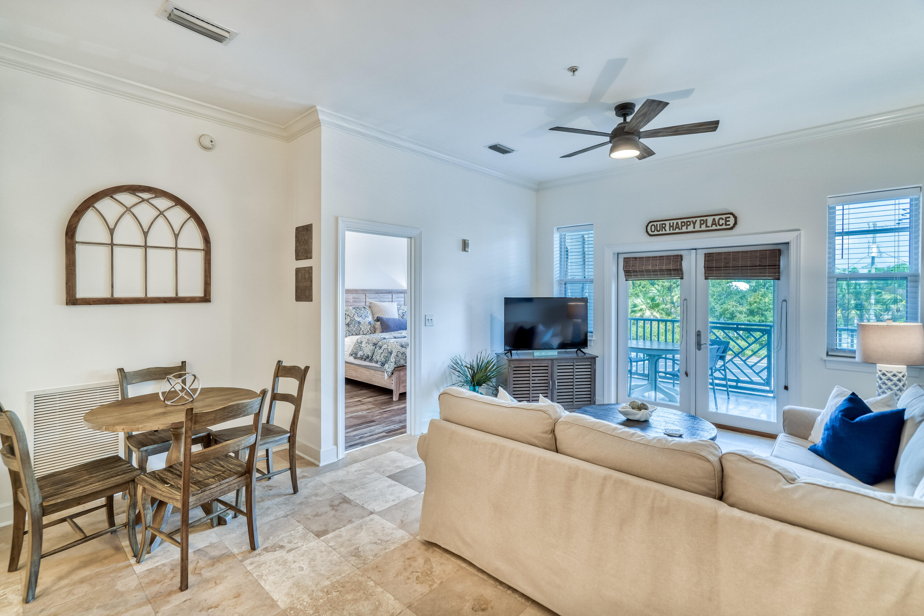 231 Somerset Bridge Road, Unit 1207 Santa Rosa Beach, FL 32459 - Photo 14 of 48 a living room with furniture a fireplace and a large window