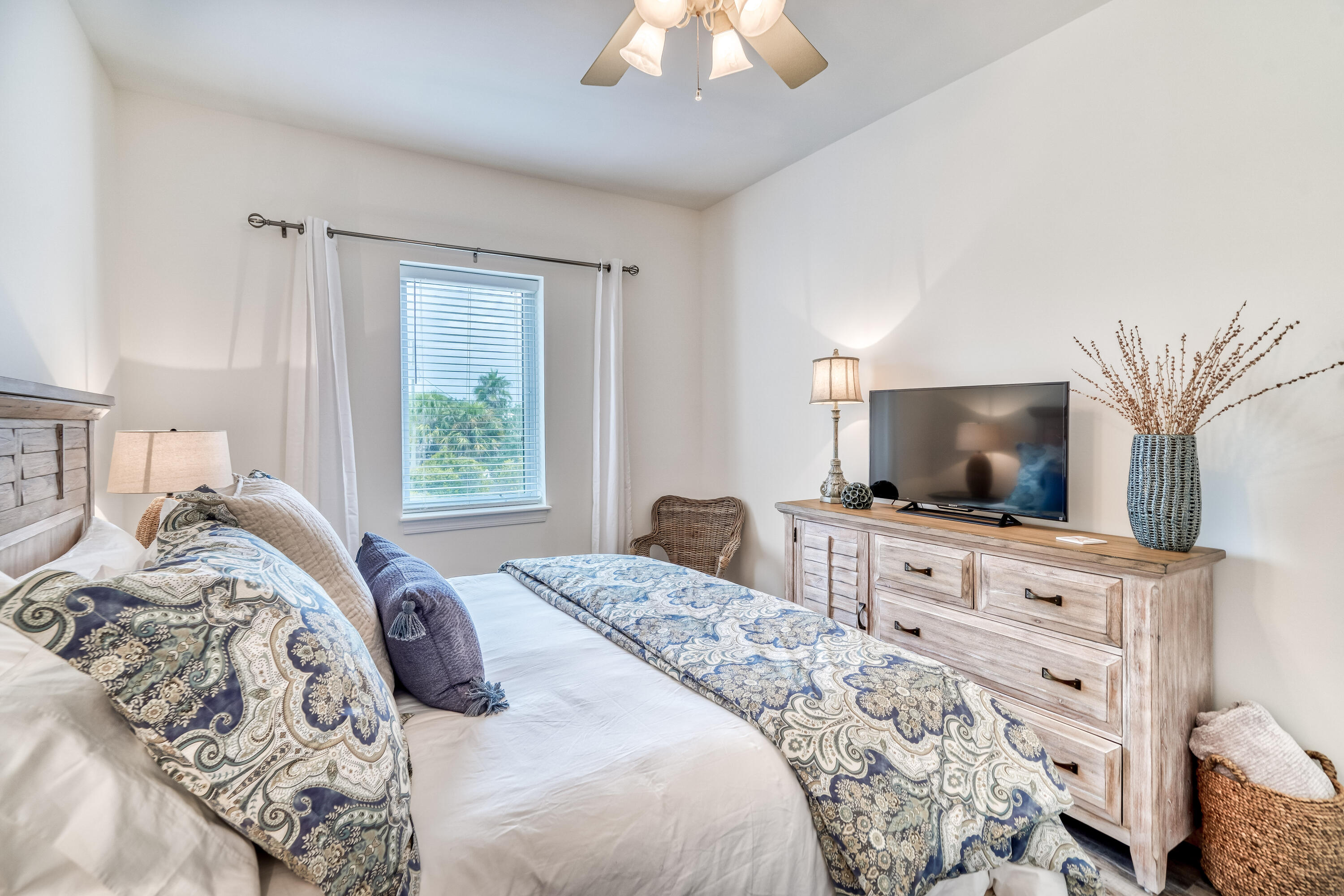 231 Somerset Bridge Road, Unit 1207 Santa Rosa Beach, FL 32459 - Photo 17 of 48 a bedroom with a bed and a flat screen tv