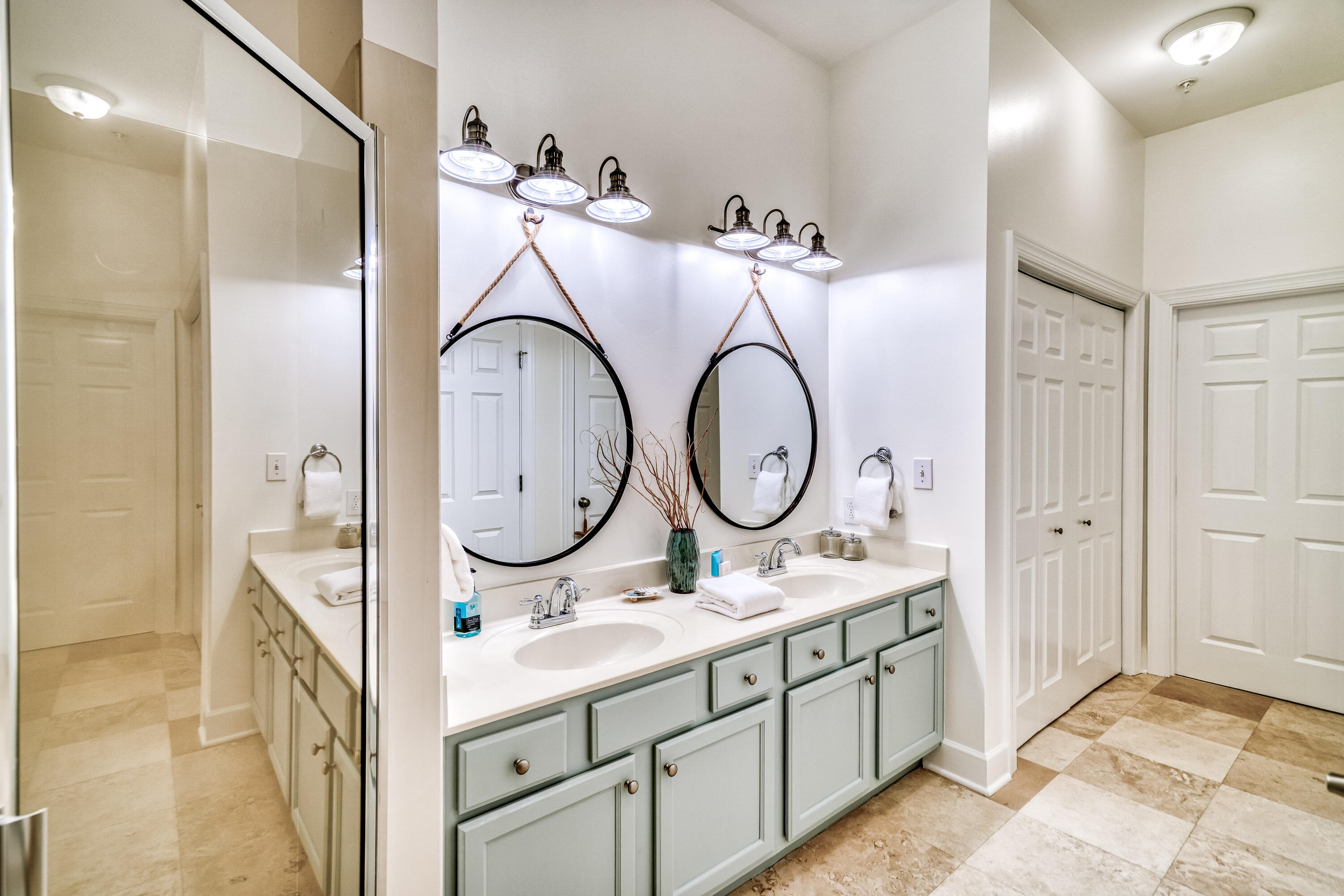 231 Somerset Bridge Road, Unit 1207 Santa Rosa Beach, FL 32459 - Photo 21 of 48 a bathroom with a double vanity sink and a mirror with shower