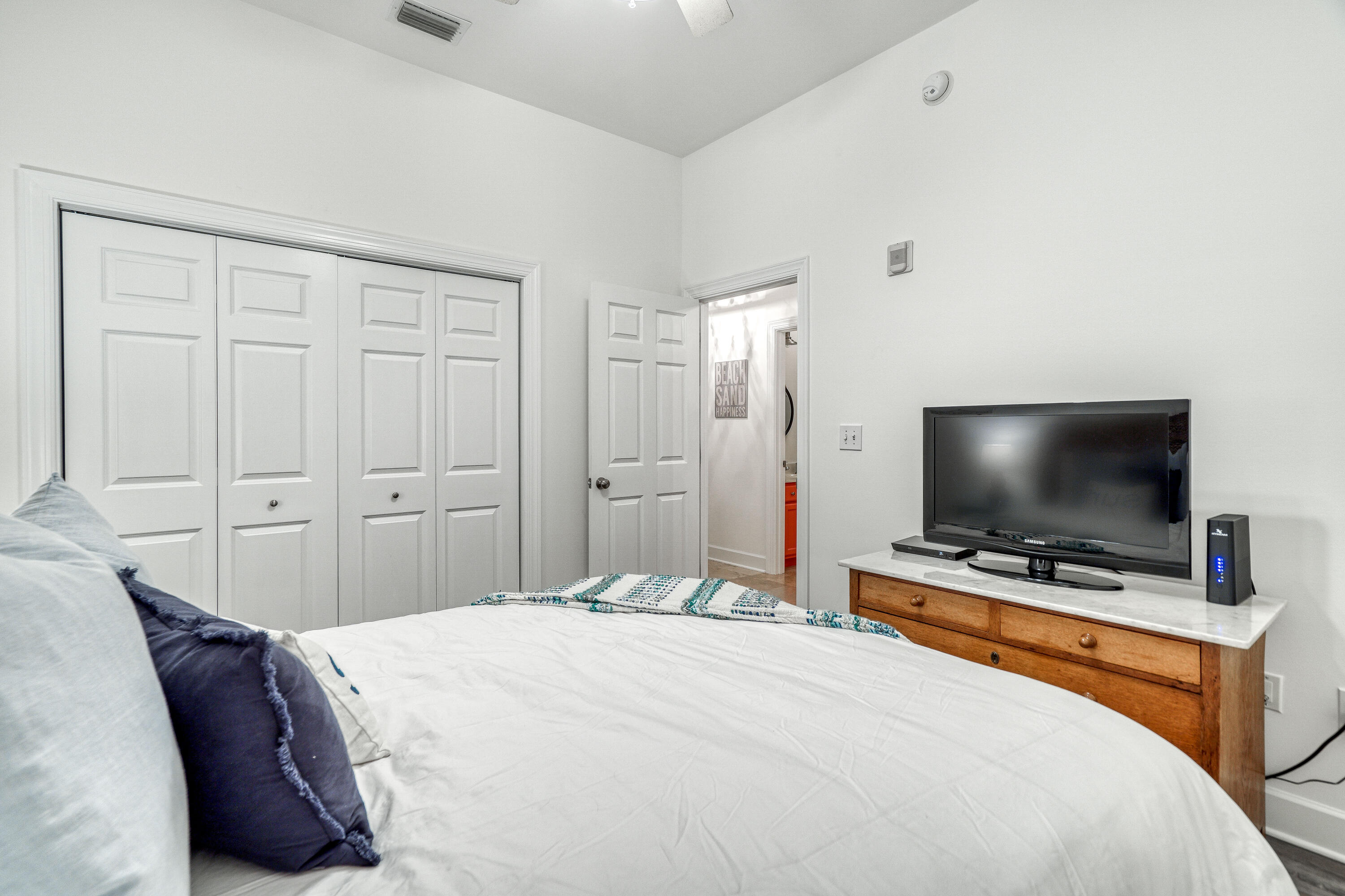231 Somerset Bridge Road, Unit 1207 Santa Rosa Beach, FL 32459 - Photo 28 of 48 a bedroom with a bed and a flat screen tv