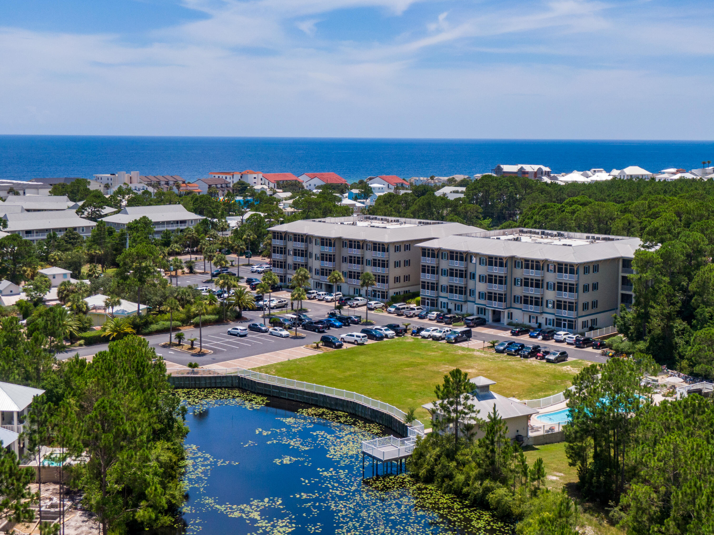 231 Somerset Bridge Road, Unit 1207 Santa Rosa Beach, FL 32459 - Photo 3 of 48 an aerial view of a house with a swimming pool outdoor seating and yard