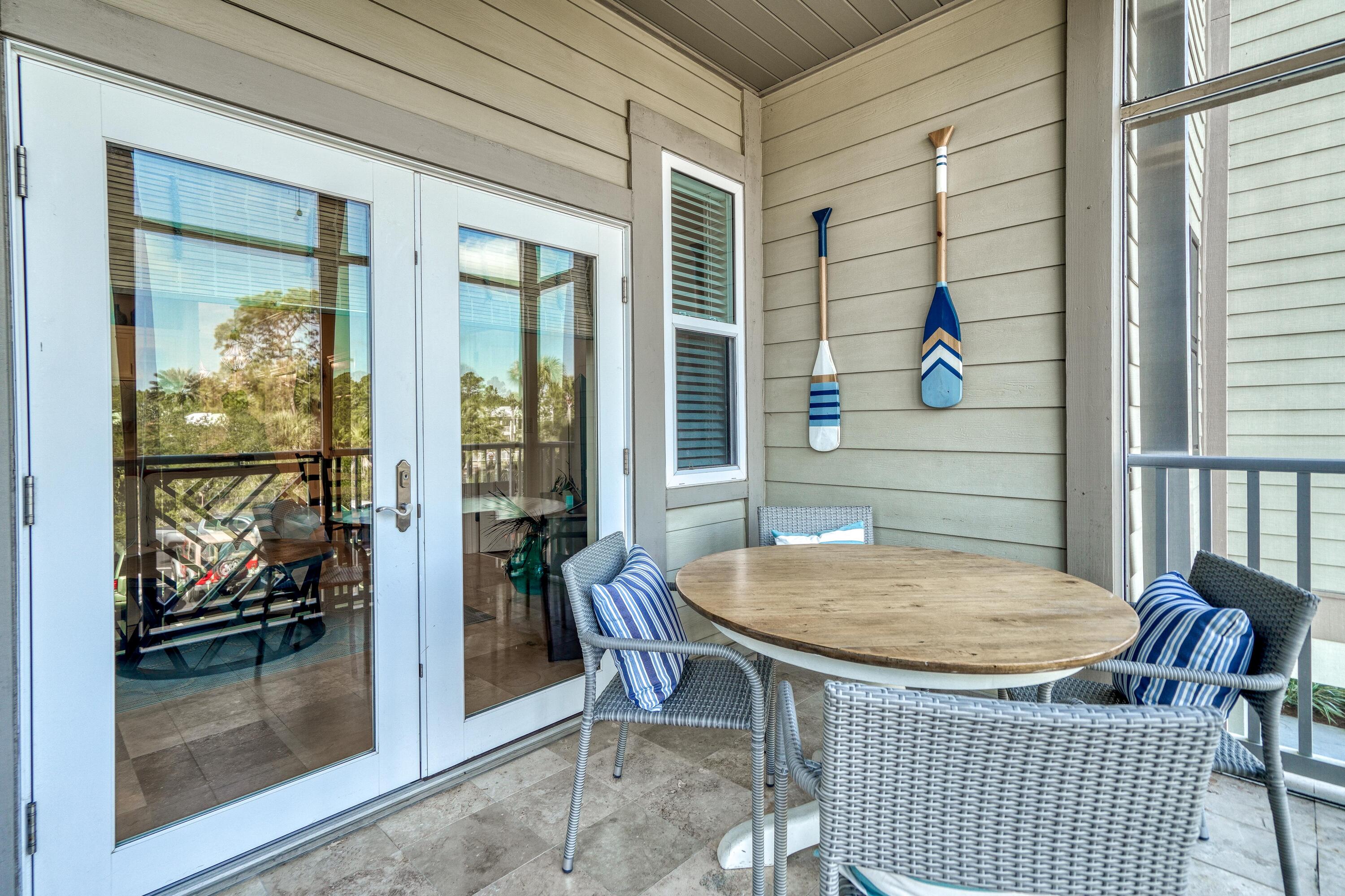 231 Somerset Bridge Road, Unit 1207 Santa Rosa Beach, FL 32459 - Photo 33 of 48 a outdoor dining space with a table and chairs