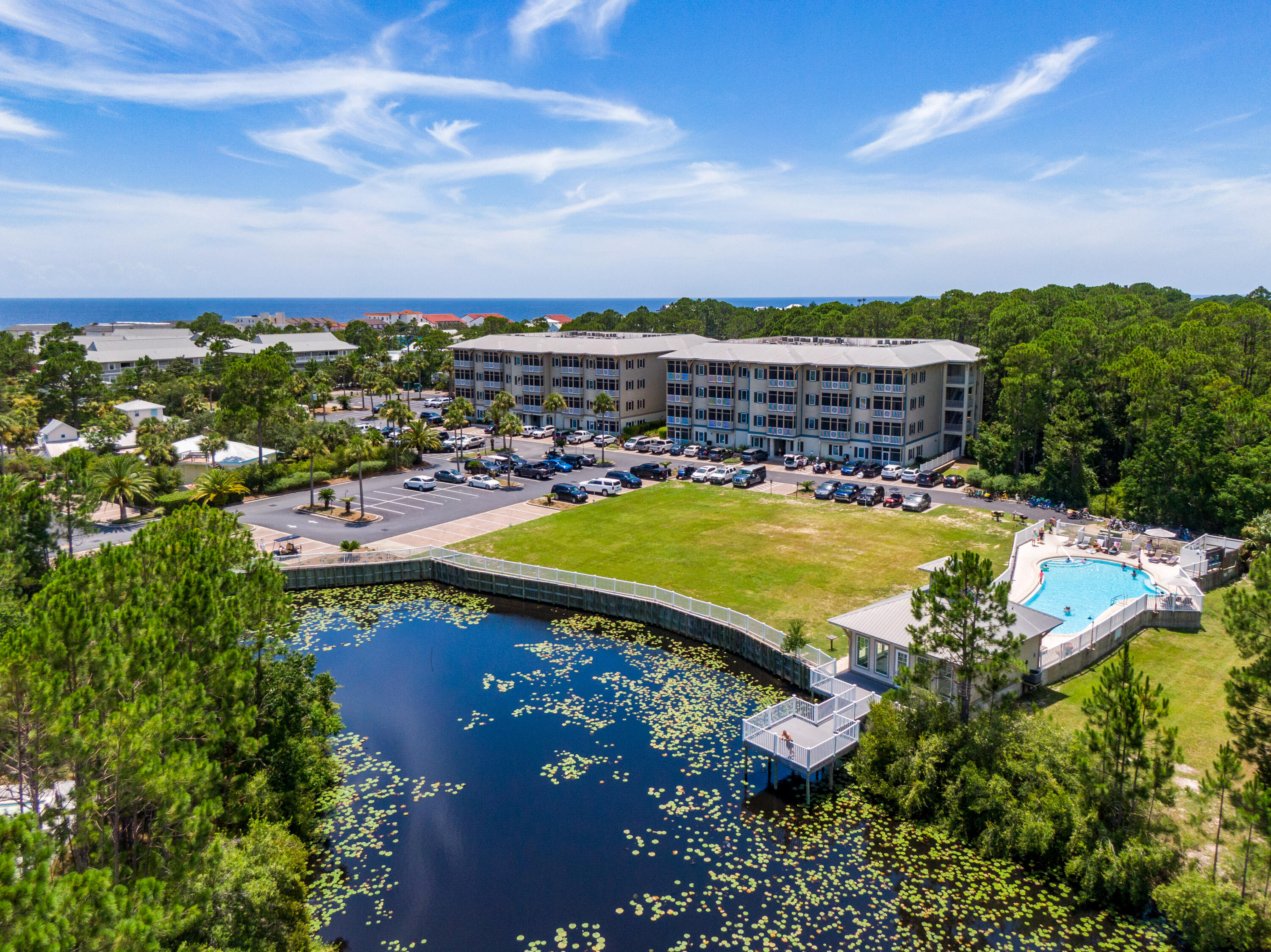 231 Somerset Bridge Road, Unit 1207 Santa Rosa Beach, FL 32459 - Photo 39 of 48 a view of a swimming pool with an outdoor seating and a yard