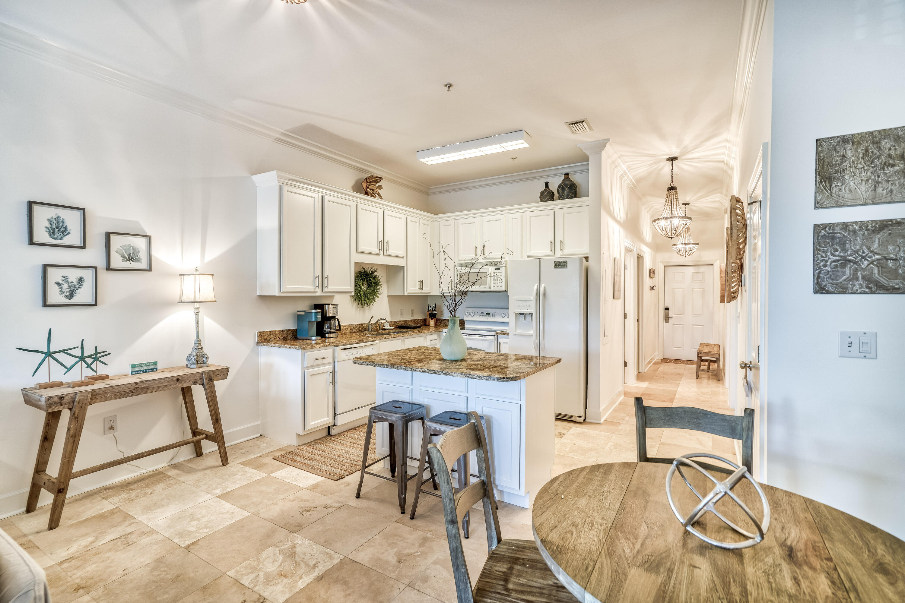 231 Somerset Bridge Road, Unit 1207 Santa Rosa Beach, FL 32459 - Photo 5 of 48 a room with stainless steel appliances kitchen island granite countertop furniture and a wooden floors