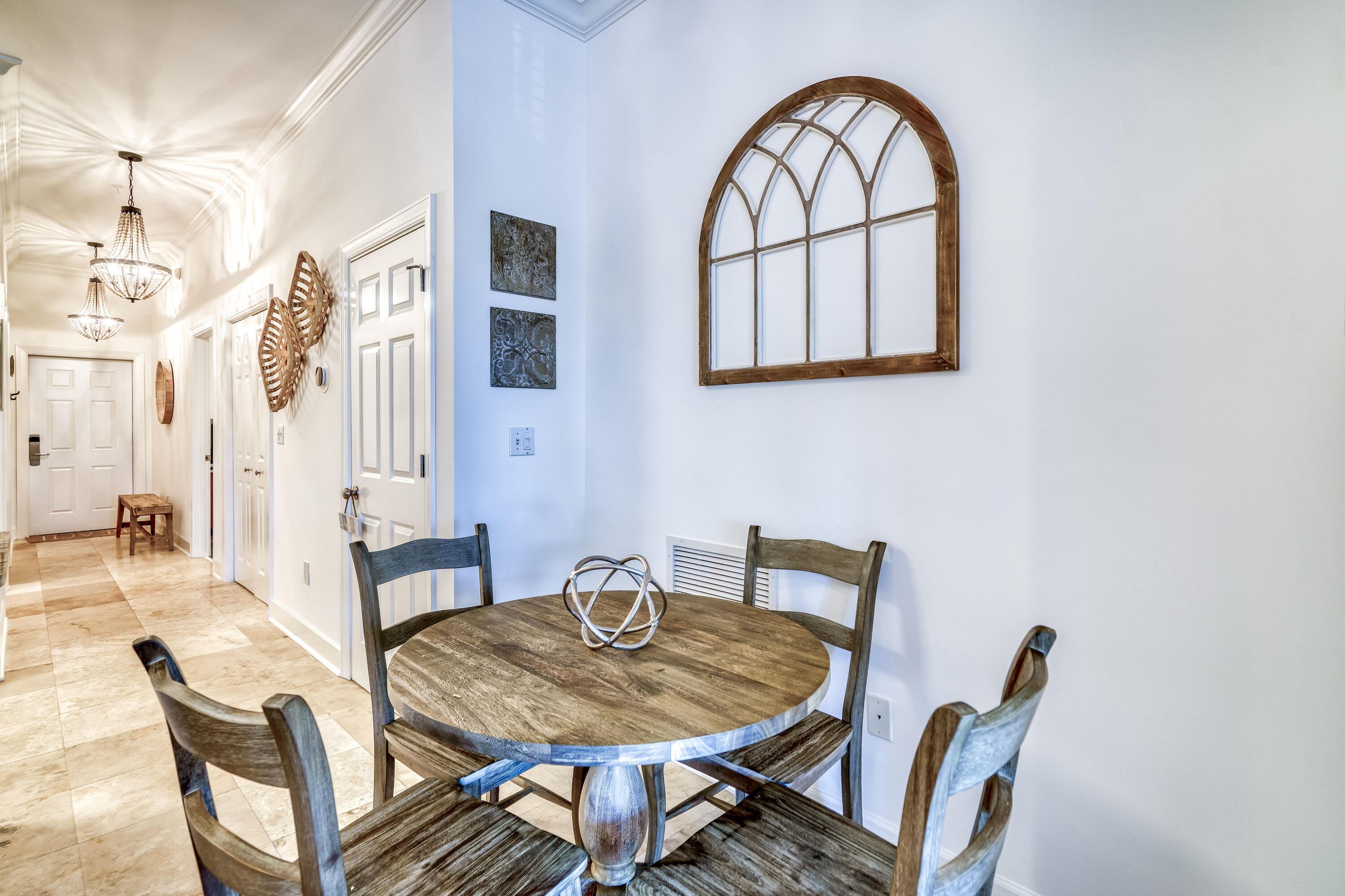231 Somerset Bridge Road, Unit 1207 Santa Rosa Beach, FL 32459 - Photo 6 of 48 a view of a dining room with furniture and a potted plant