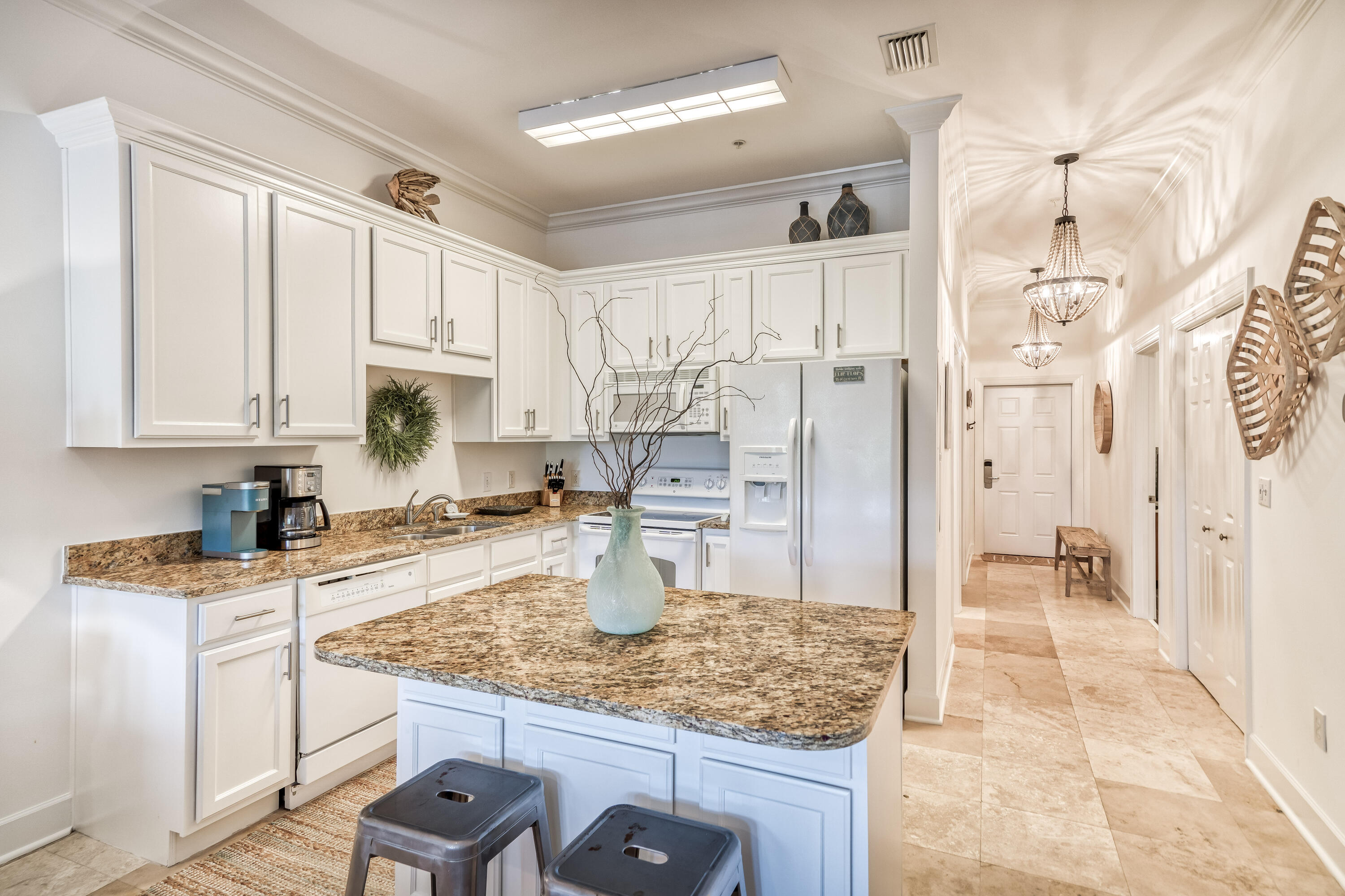 231 Somerset Bridge Road, Unit 1207 Santa Rosa Beach, FL 32459 - Photo 9 of 48 a kitchen with stainless steel appliances granite countertop a sink refrigerator and cabinets
